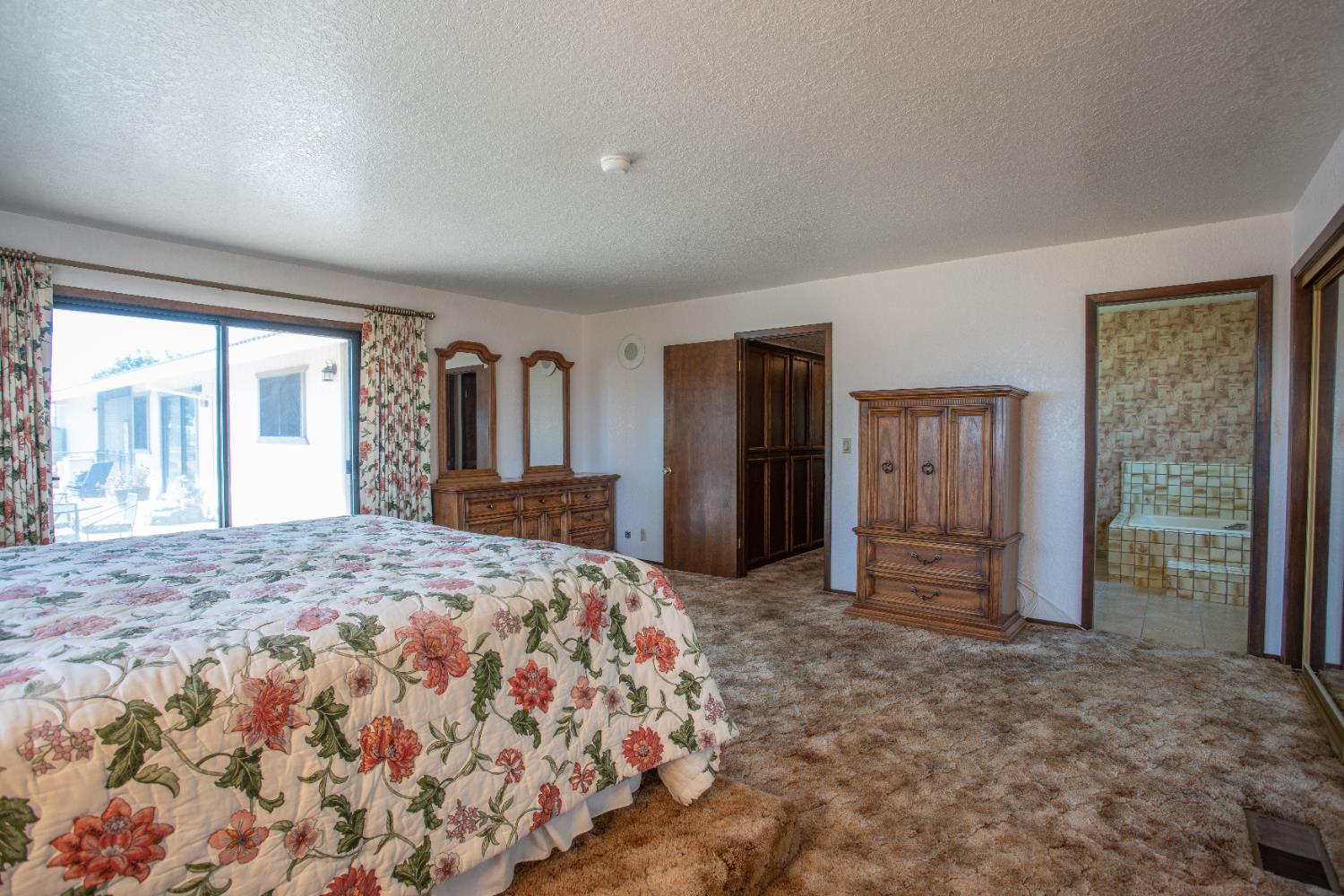 6323 Excelsior Road Sacramento, CA 95830 - Photo 34 of 75 a bedroom with a large bed closet and large window