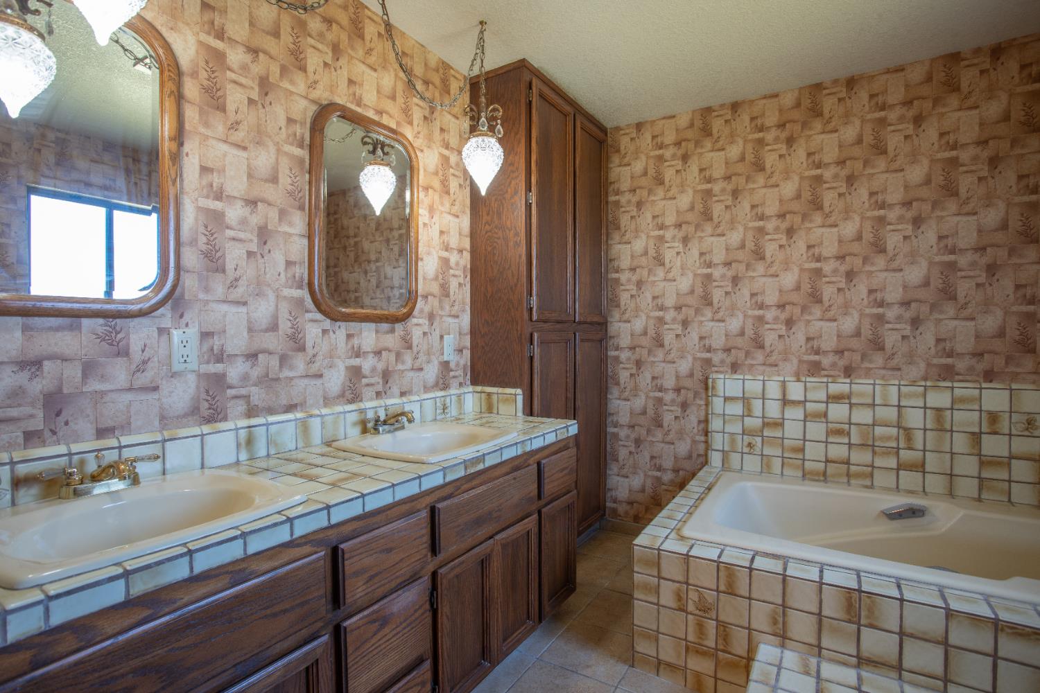 6323 Excelsior Road Sacramento, CA 95830 - Photo 36 of 75 a bathroom with a sink a toilet a mirror and bathtub