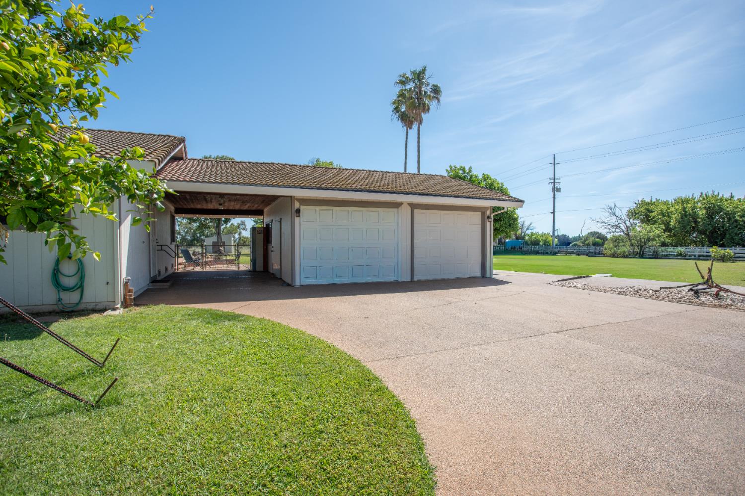 6323 Excelsior Road Sacramento, CA 95830 - Photo 45 of 75 a front view of a house with a garden and yard