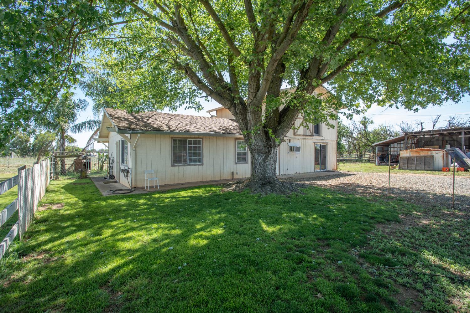 6323 Excelsior Road Sacramento, CA 95830 - Photo 49 of 75 a view of a house with backyard and a tree