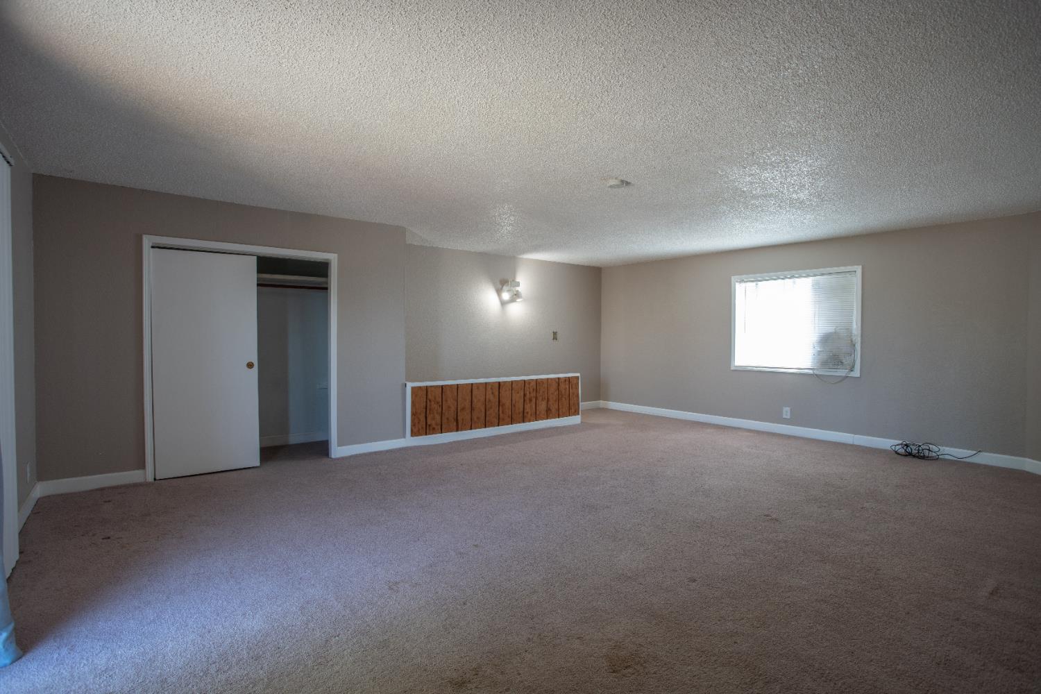 6323 Excelsior Road Sacramento, CA 95830 - Photo 65 of 75 a view of an empty room with a window