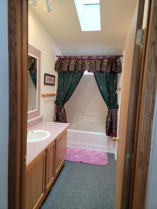 1831 Terret Road La Pine, OR 97739 - Photo 18 of 49 Master bathroom view from bedroom. Tub/shower feature. with semi-private area for commode. And a storage area.