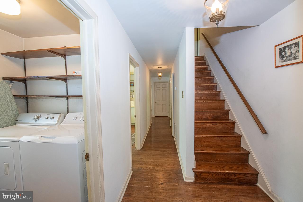 247 Church Road Devon, PA 19333 - Photo 15 of 35 a view of a hallway with washer and dryer