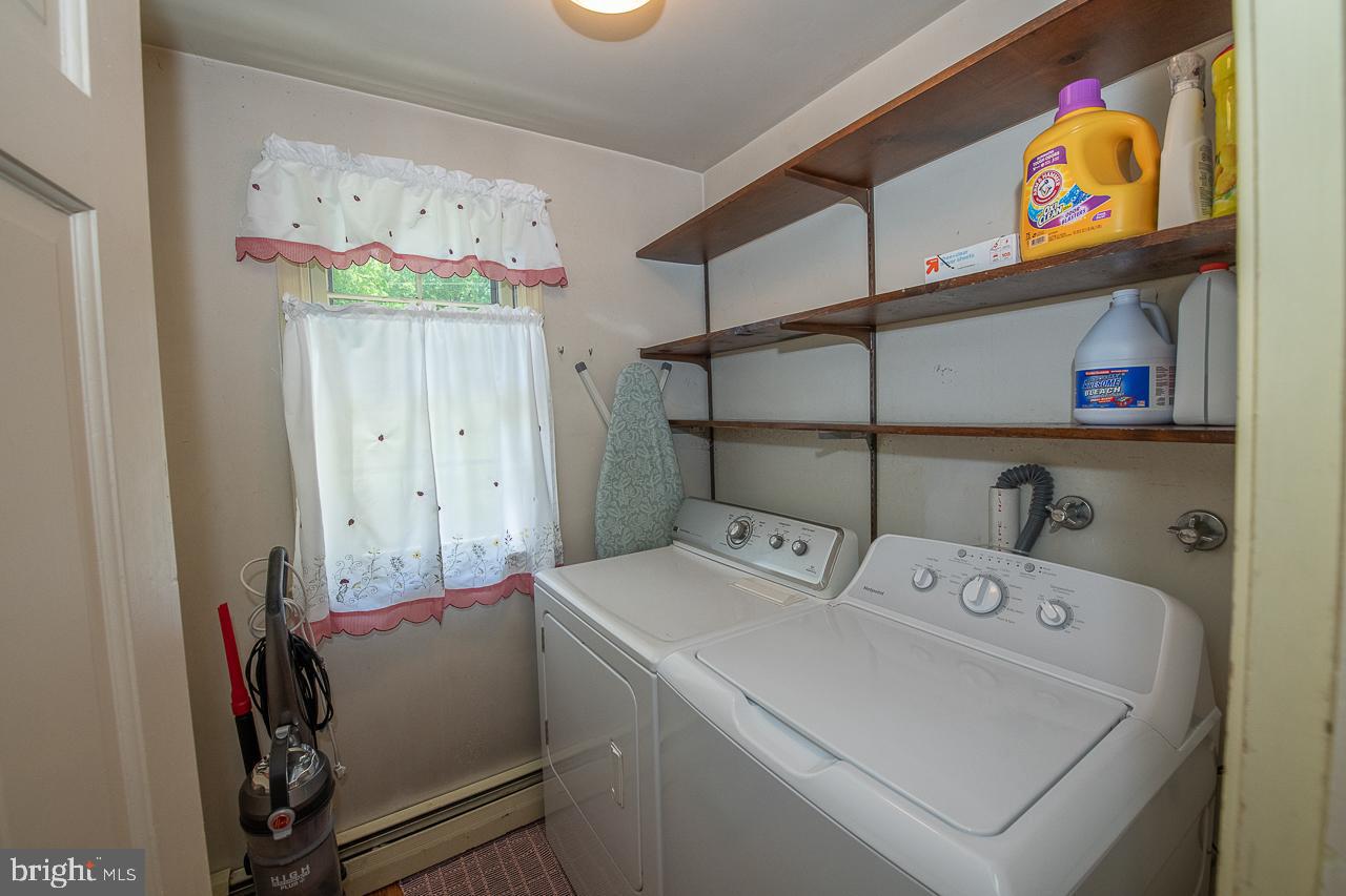 247 Church Road Devon, PA 19333 - Photo 16 of 35 a utility room with dryer and washer