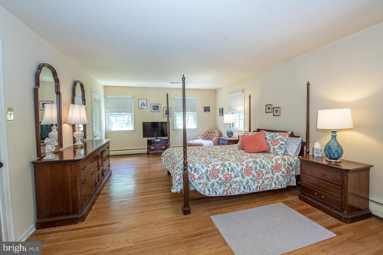 247 Church Road Devon, PA 19333 - Photo 20 of 35 a bedroom with a bed and wooden floor