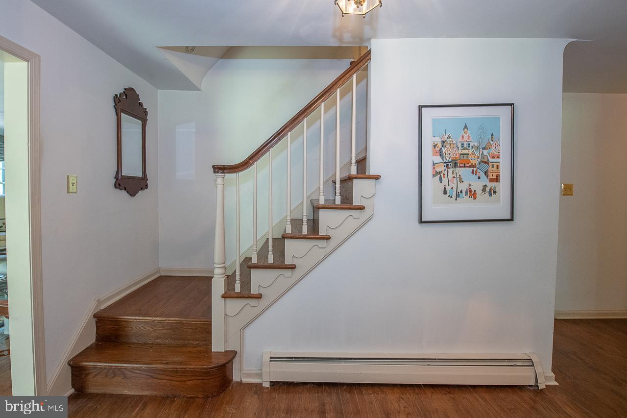 247 Church Road Devon, PA 19333 - Photo 3 of 35 a view of entryway and hall with wooden floor