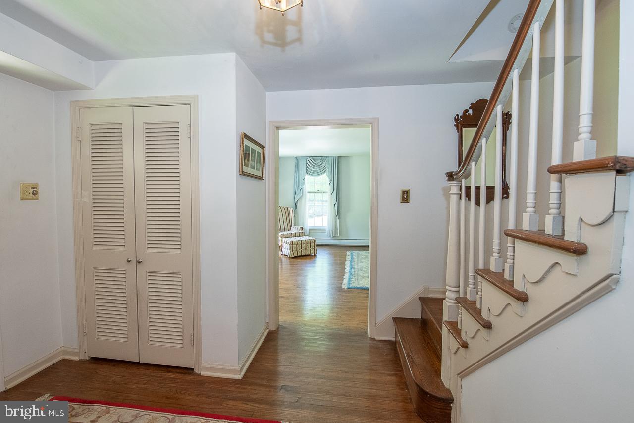 247 Church Road Devon, PA 19333 - Photo 4 of 35 a view of an entryway with wooden floor and stairs