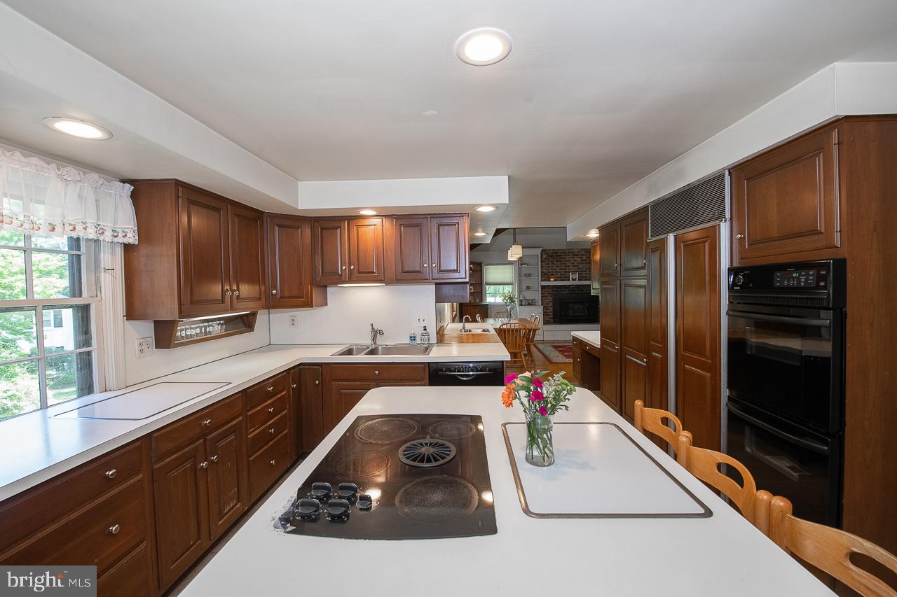 247 Church Road Devon, PA 19333 - Photo 8 of 35 a kitchen with a sink stove and refrigerator