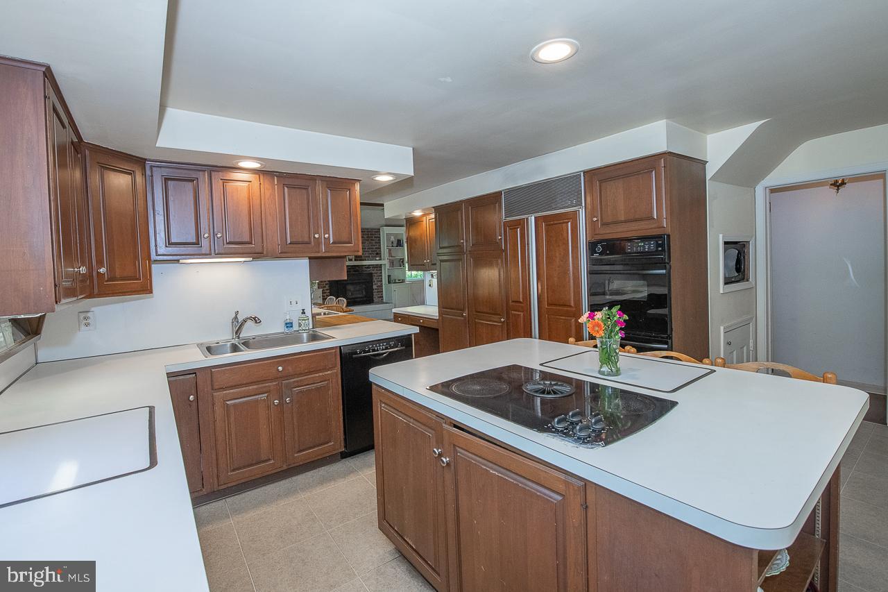 247 Church Road Devon, PA 19333 - Photo 9 of 35 a kitchen that has a sink and a refrigerator