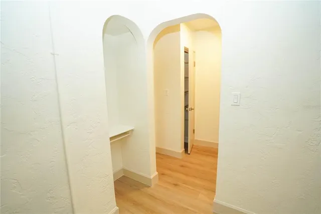 a bathroom with a sink and mirror with toilet