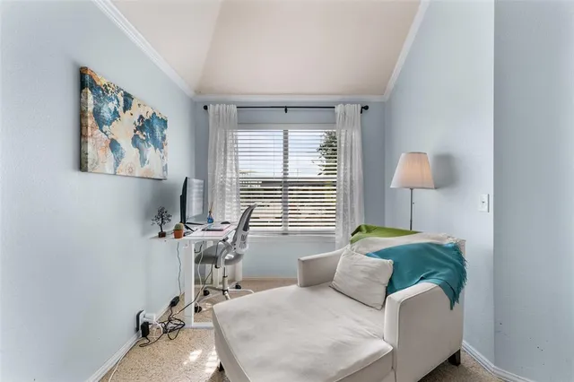 a bedroom with a bed couch and window