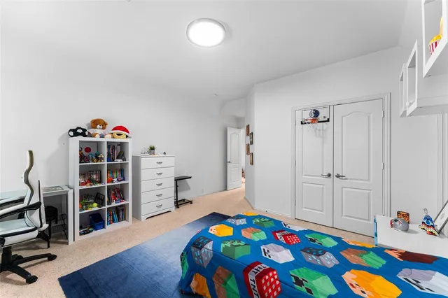 a bedroom with furniture and a wooden floor