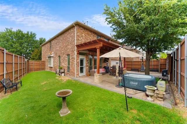 a view of a patio with couches table and chairs and potted plants