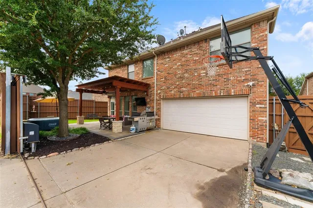 a patio with patio lots of furniture and tub