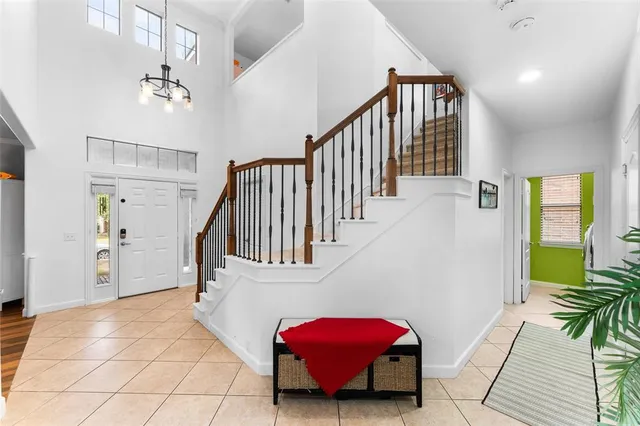 a view of a bedroom with furniture and staircase