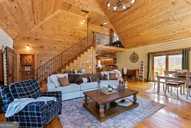 a view of a livingroom with furniture and a rug