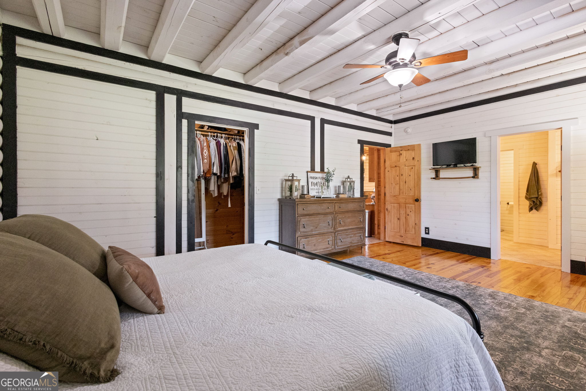 1382 Intermediate Road Harlem, GA 30814 - Photo 16 of 67 a bed room with a bed and a walk in closet