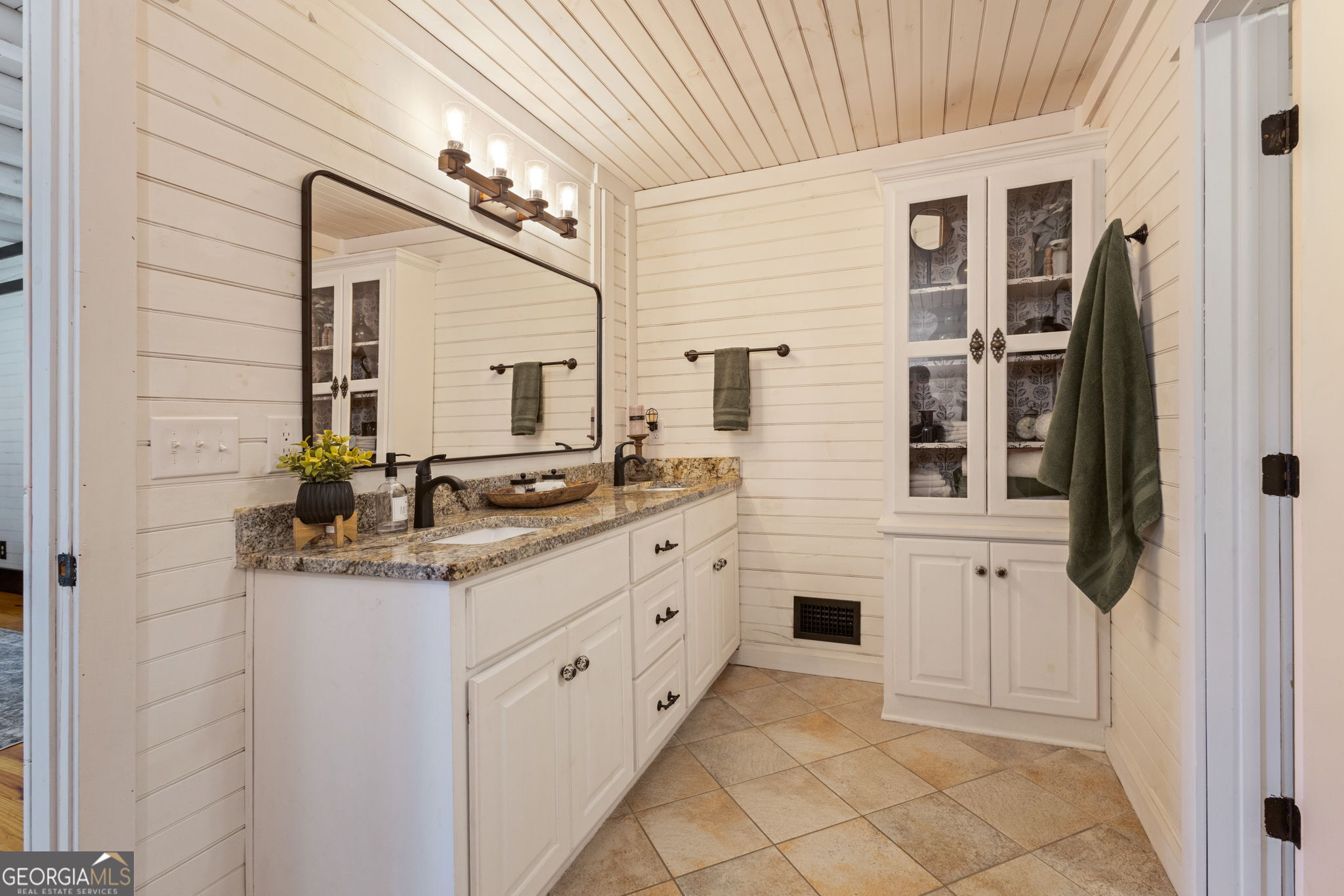 1382 Intermediate Road Harlem, GA 30814 - Photo 19 of 67 a bathroom with a granite countertop sink a mirror and a shower