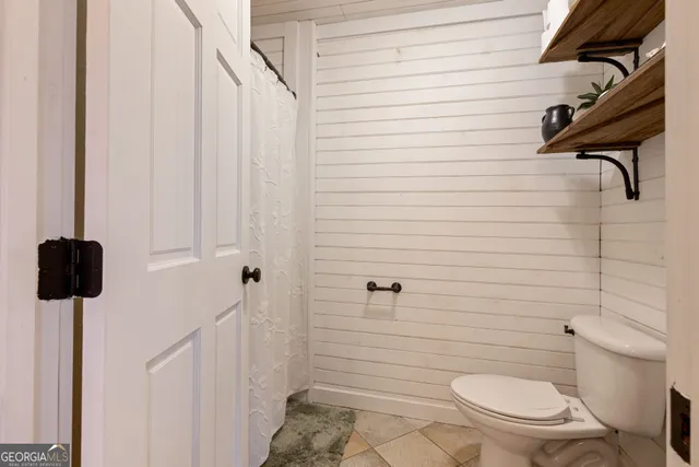 a bathroom with a shower and a window
