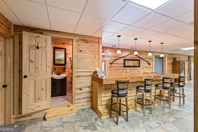 a view of balcony with wooden floor and seating space