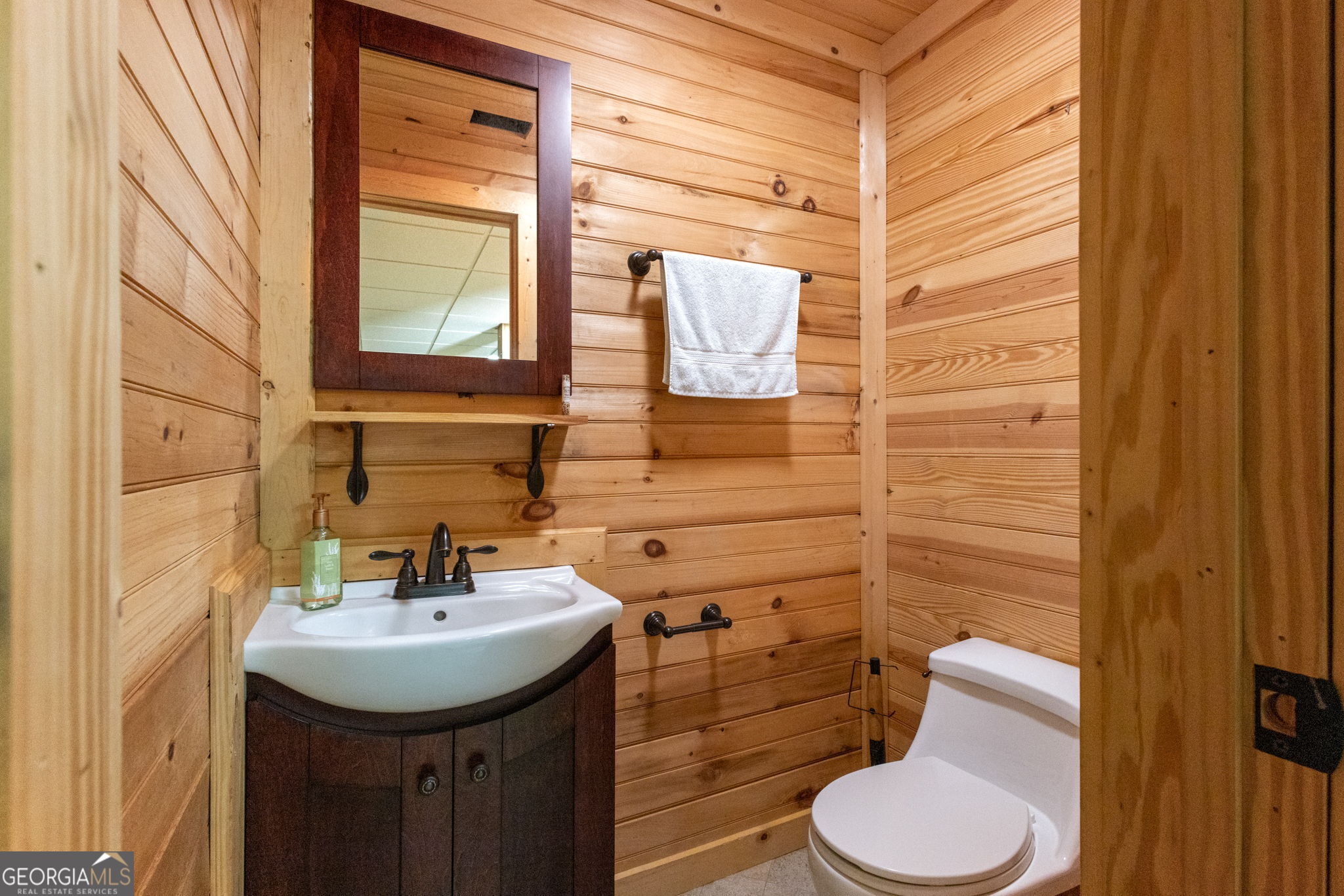 1382 Intermediate Road Harlem, GA 30814 - Photo 29 of 67 a bathroom with a sink a toilet and mirror