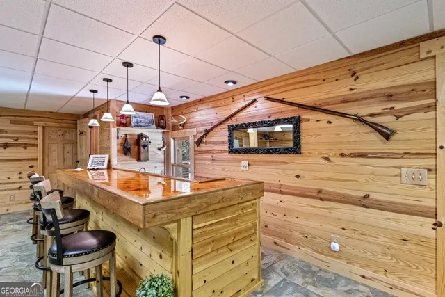 a bedroom with furniture and wooden floor