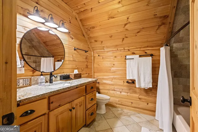 a view of a porch with chairs and backyard