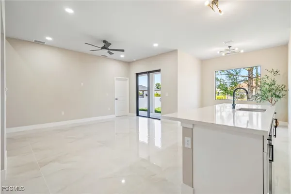 a kitchen with stainless steel appliances a refrigerator and a microwave