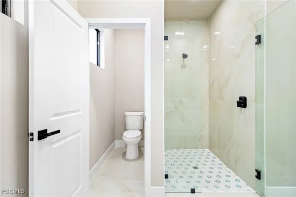 a bathroom with 2 sink and a mirror