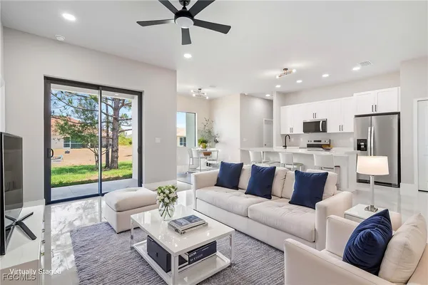 a living room with furniture and a large window
