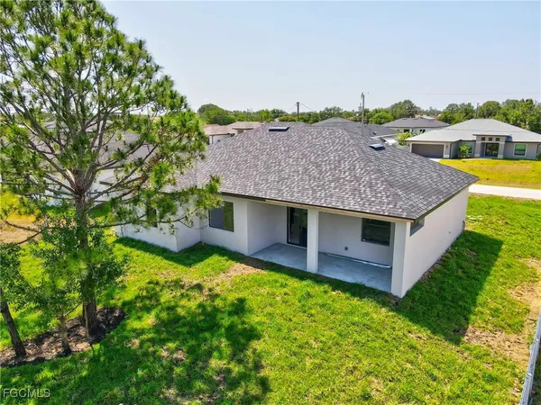 a house view with a backyard space