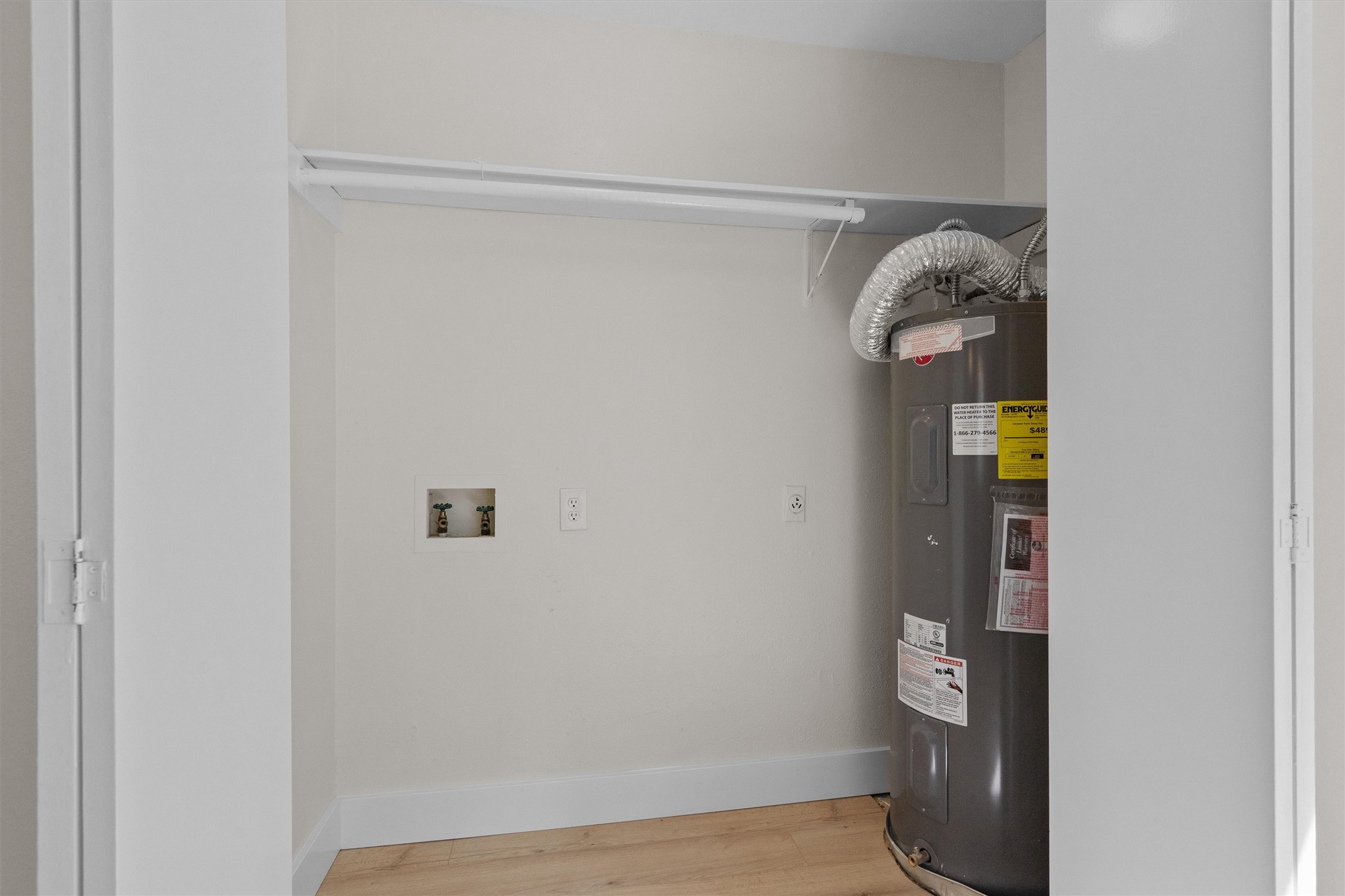 1707 Waterloo Trail Austin, TX 78704 - Photo 14 of 39 Utility room featuring water heater