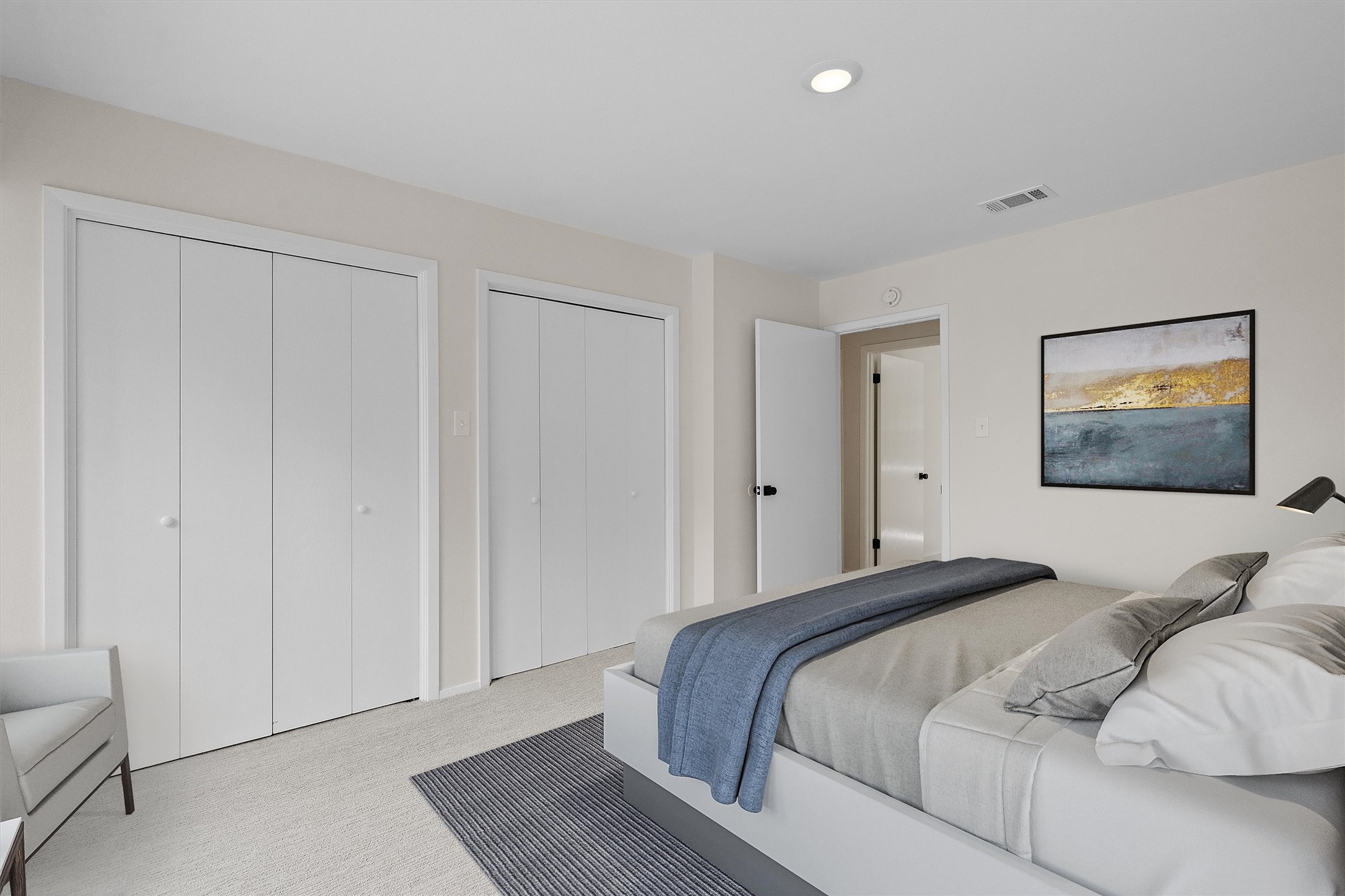 1707 Waterloo Trail Austin, TX 78704 - Photo 16 of 39 Bedroom with light carpet and multiple closets