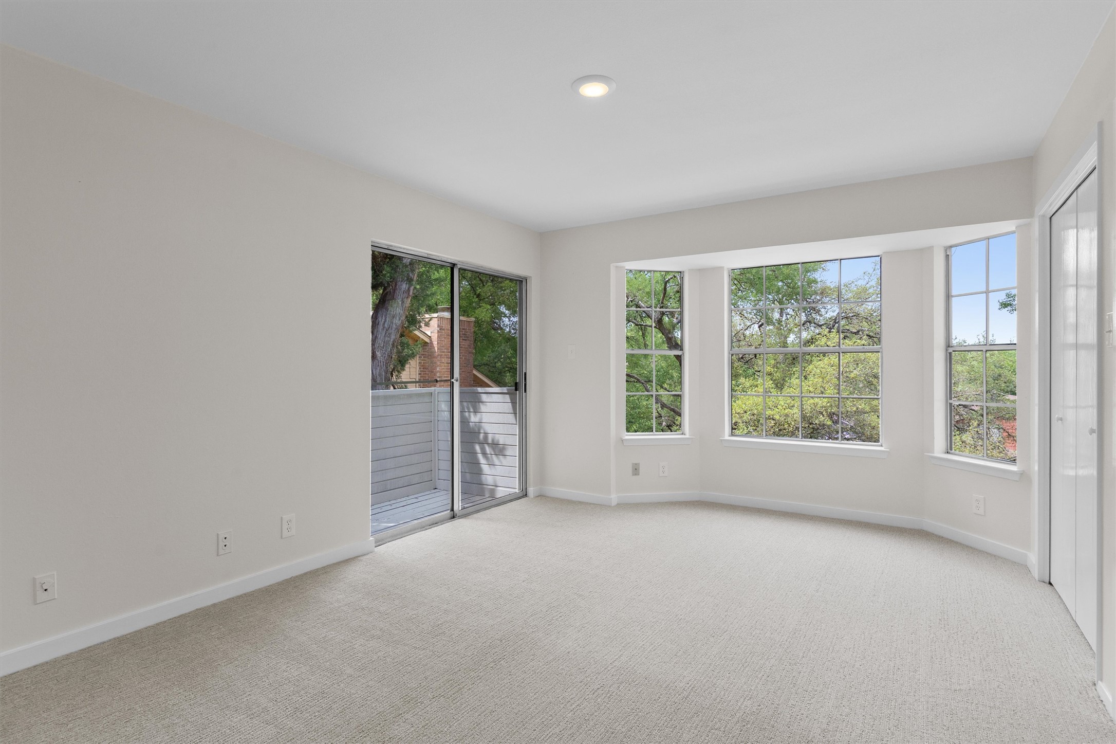 1707 Waterloo Trail Austin, TX 78704 - Photo 18 of 39 Spare room with light carpet and recessed lighting