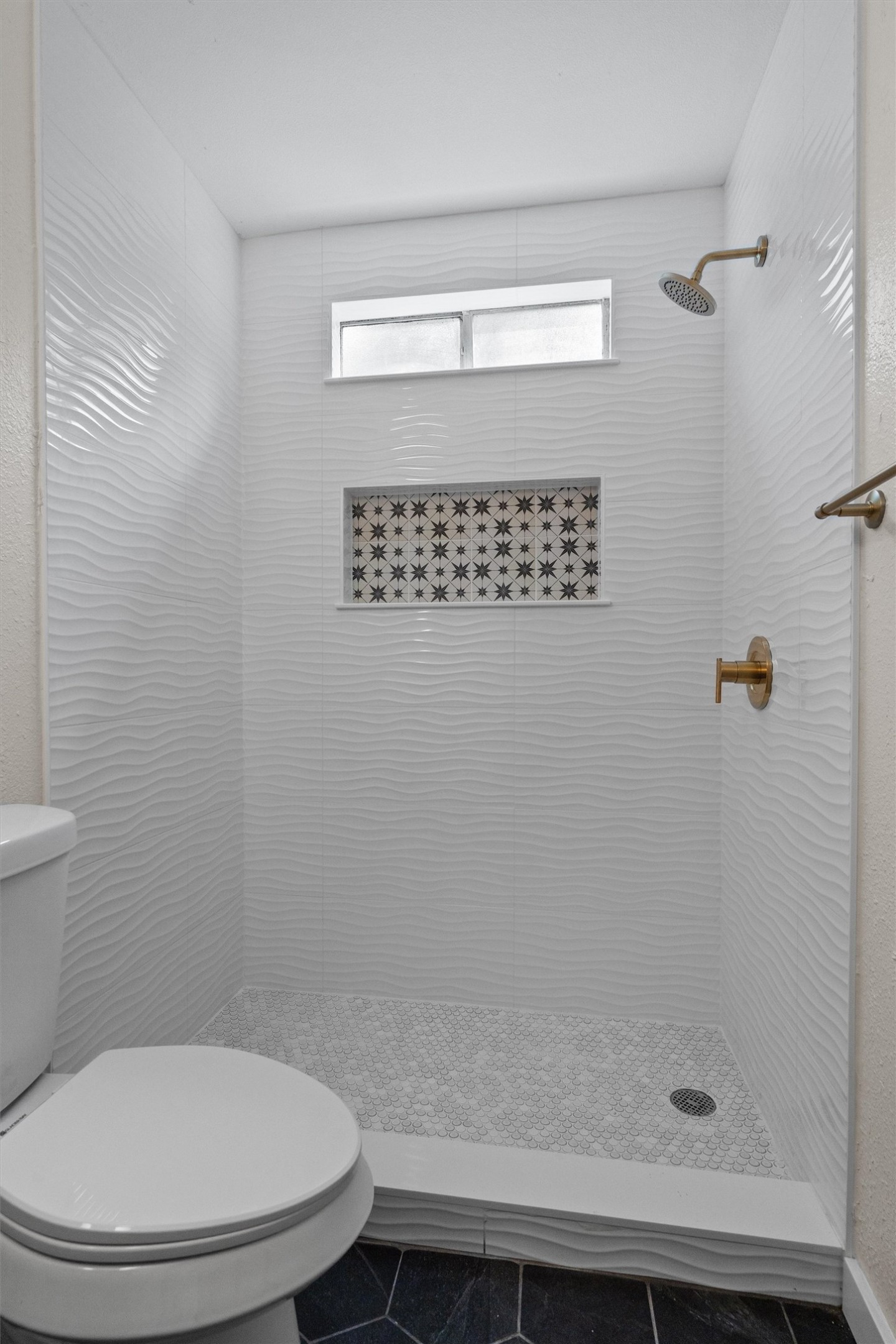 1707 Waterloo Trail Austin, TX 78704 - Photo 22 of 39 Bathroom featuring a stall shower and dark tile patterned flooring