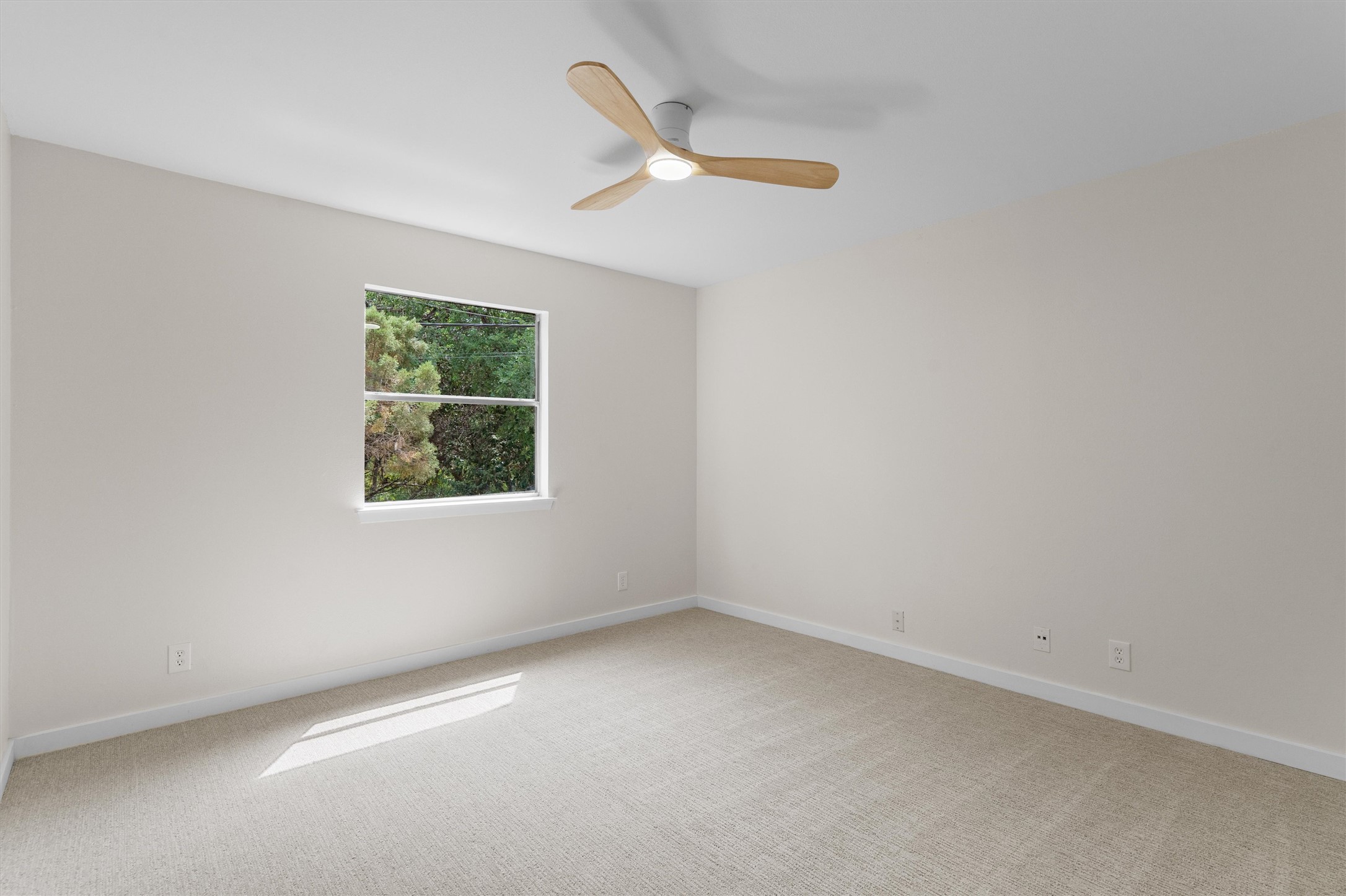 1707 Waterloo Trail Austin, TX 78704 - Photo 24 of 39 Spare room with light carpet and ceiling fan
