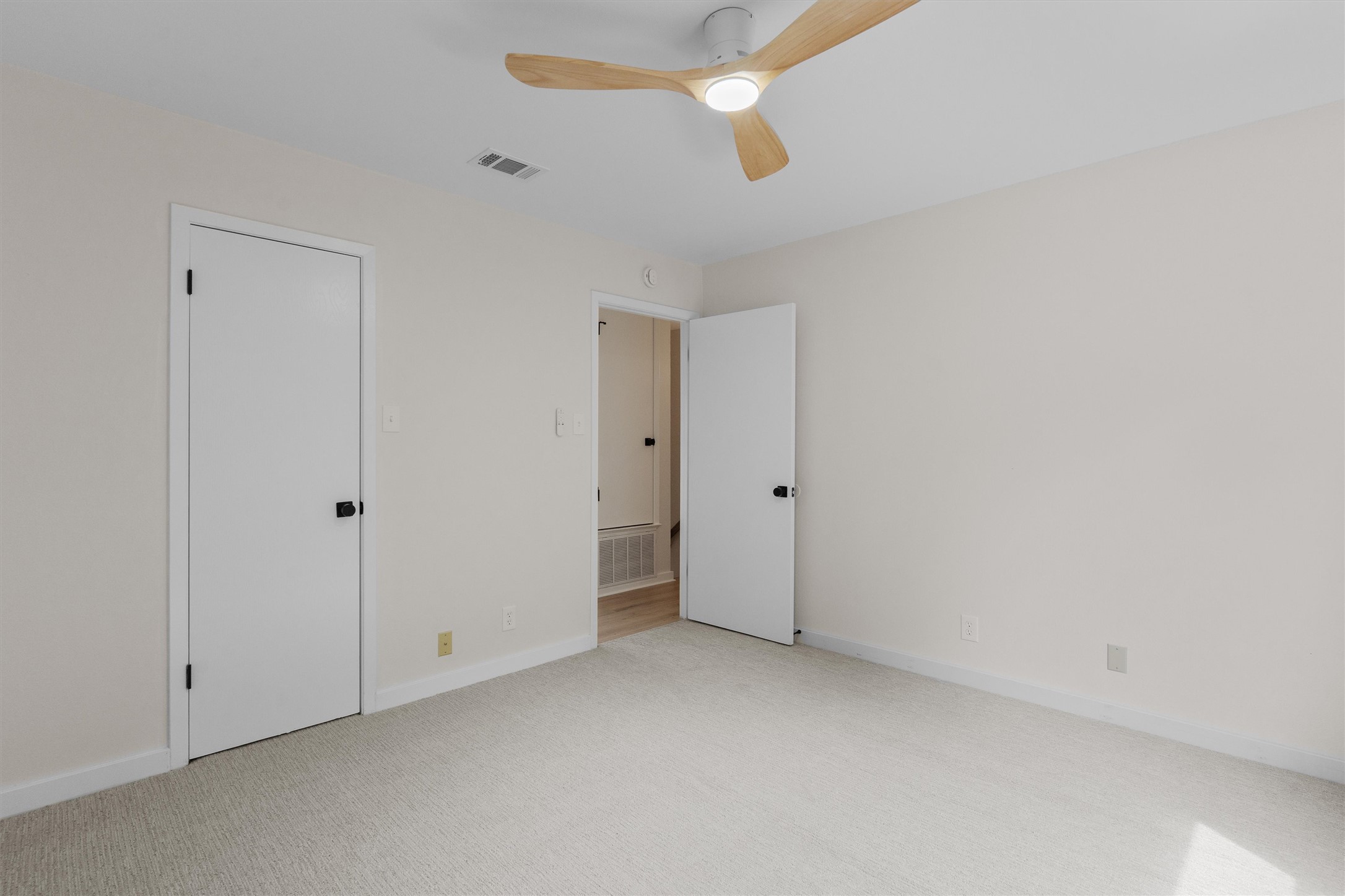 1707 Waterloo Trail Austin, TX 78704 - Photo 25 of 39 Unfurnished bedroom with light carpet and ceiling fan