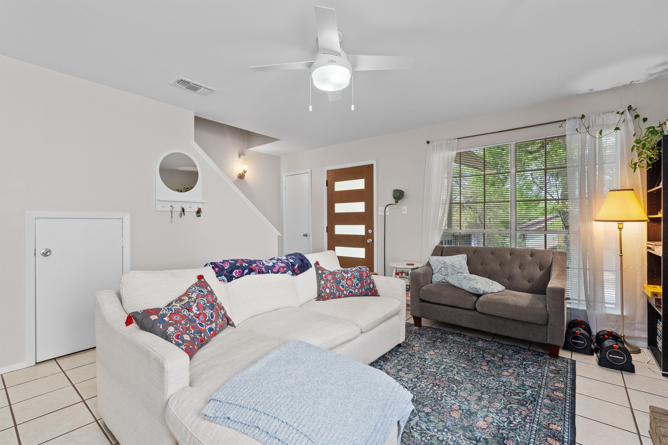 1707 Waterloo Trail Austin, TX 78704 - Photo 27 of 39 Living room with light tile patterned flooring and a ceiling fan