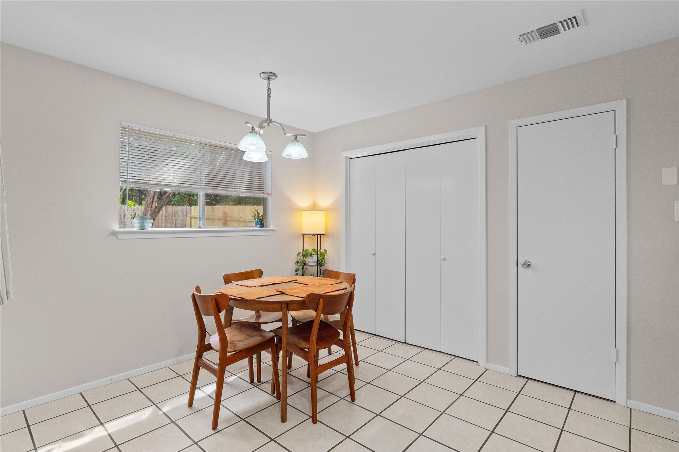 1707 Waterloo Trail Austin, TX 78704 - Photo 33 of 39 Dining area featuring hanging lights and light tile patterned floors