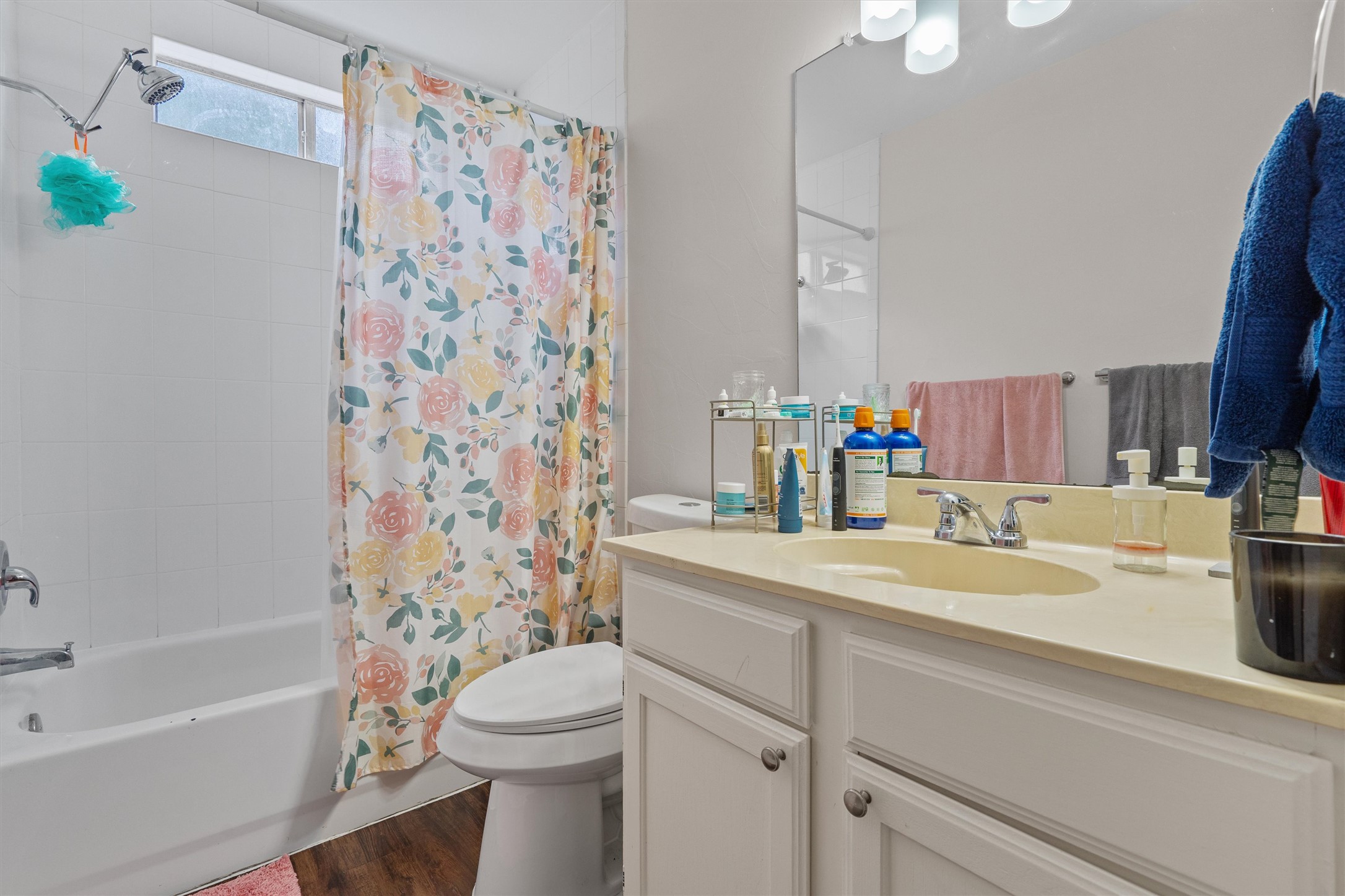 1707 Waterloo Trail Austin, TX 78704 - Photo 35 of 39 Full bath with vanity, shower / bath combo, and dark wood-style flooring