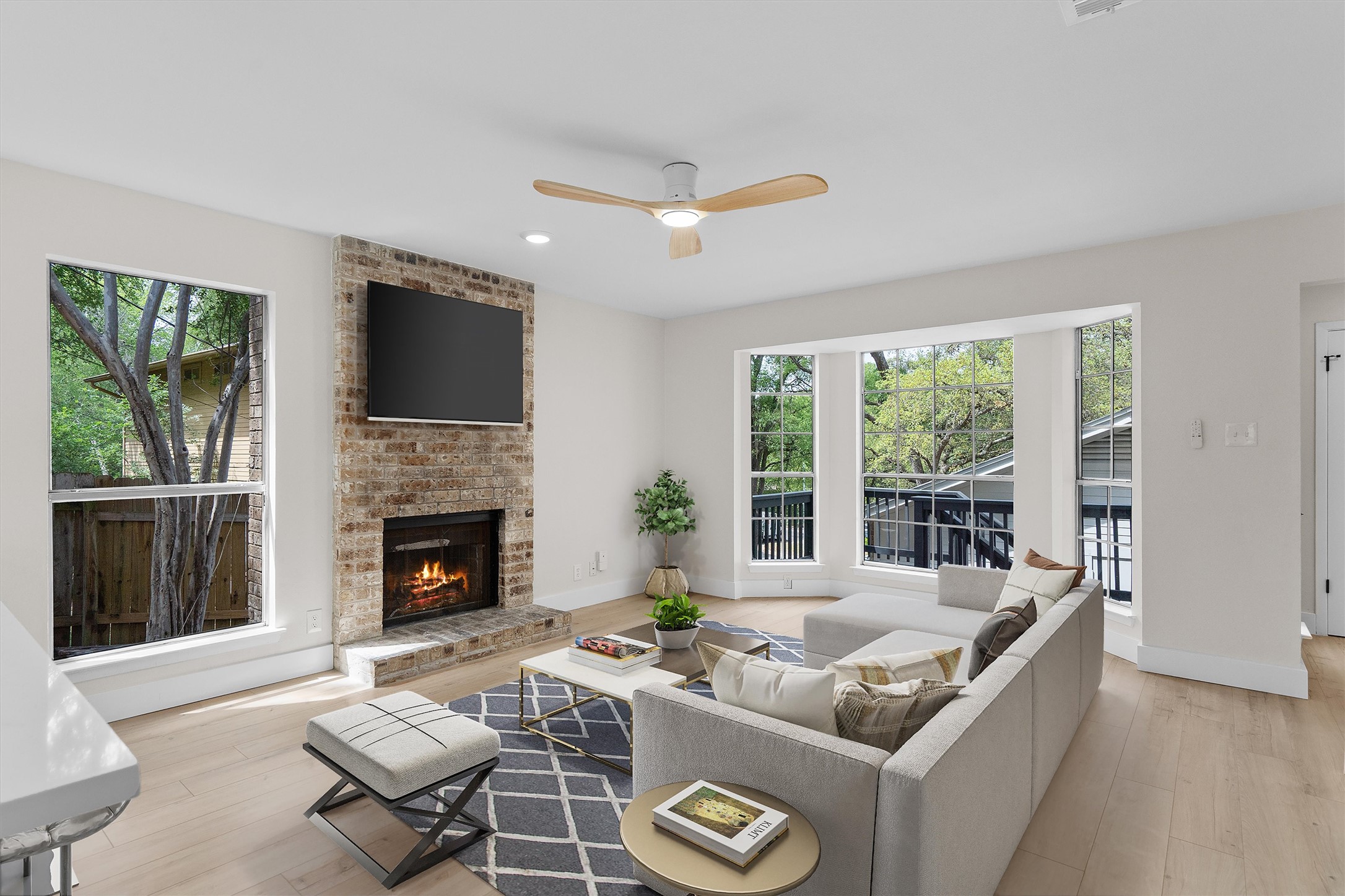 1707 Waterloo Trail Austin, TX 78704 - Photo 7 of 39 Living room with ceiling fan, healthy amount of natural light, light wood-style floors, a fireplace, and recessed lighting