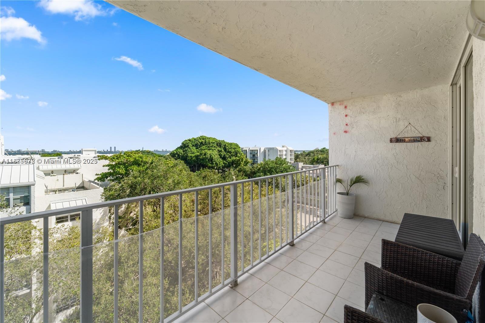 650 Northeast 64th Street, Unit GPH4 Miami, FL 33138 - Photo 13 of 24 a view of balcony with furniture