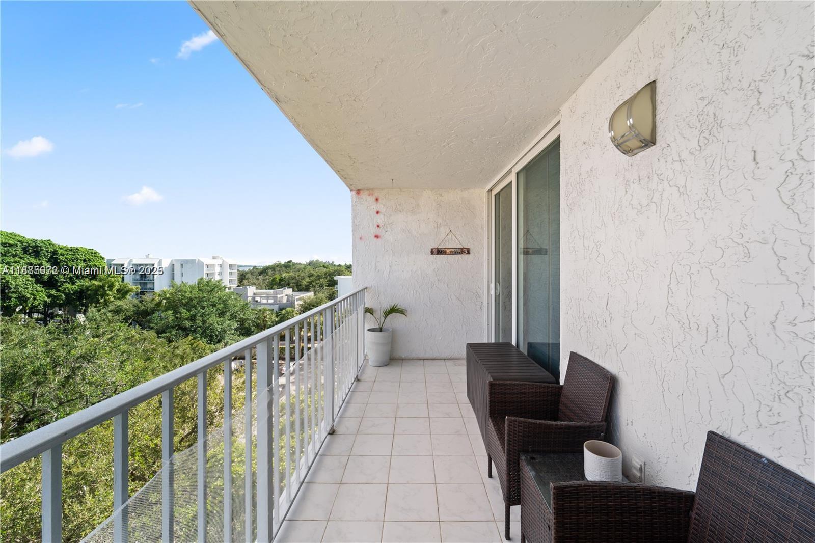 650 Northeast 64th Street, Unit GPH4 Miami, FL 33138 - Photo 14 of 24 a view of balcony with furniture