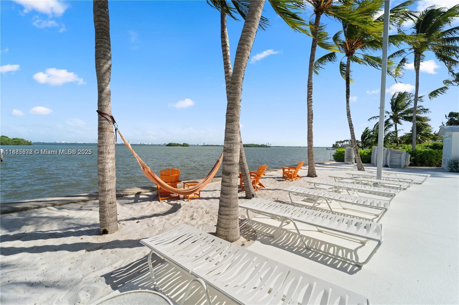 650 Northeast 64th Street, Unit GPH4 Miami, FL 33138 - Photo 19 of 24 a view of a terrace with chairs