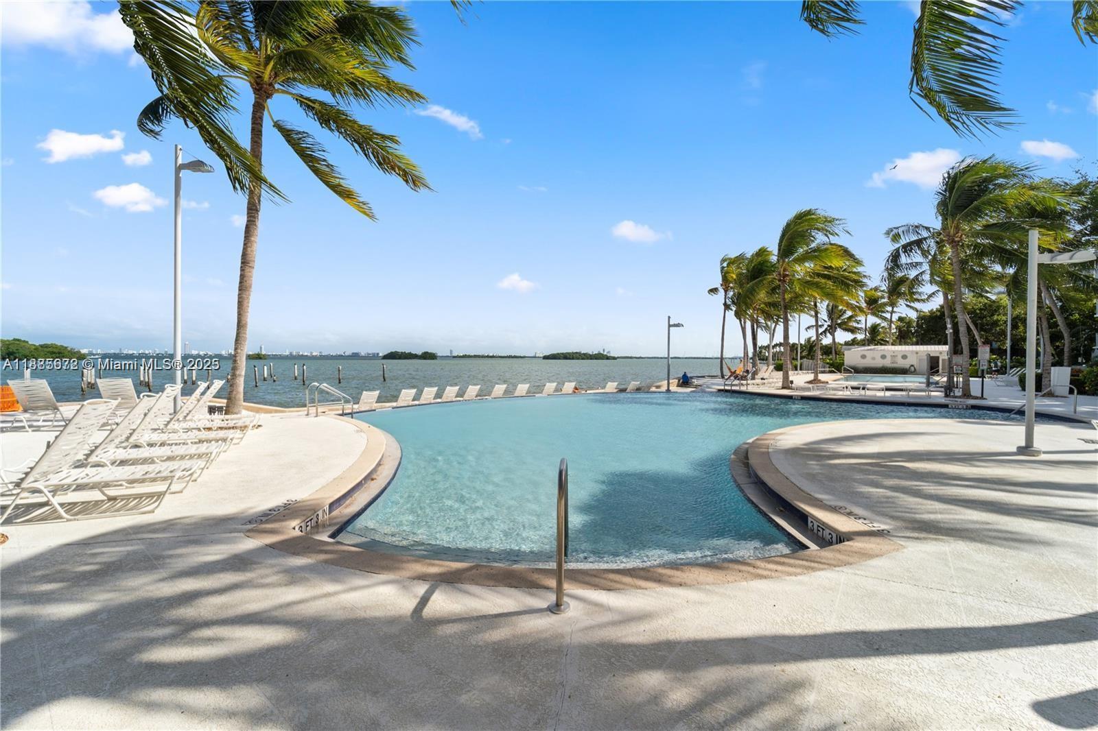 650 Northeast 64th Street, Unit GPH4 Miami, FL 33138 - Photo 20 of 24 a view of a swimming pool with a terrace