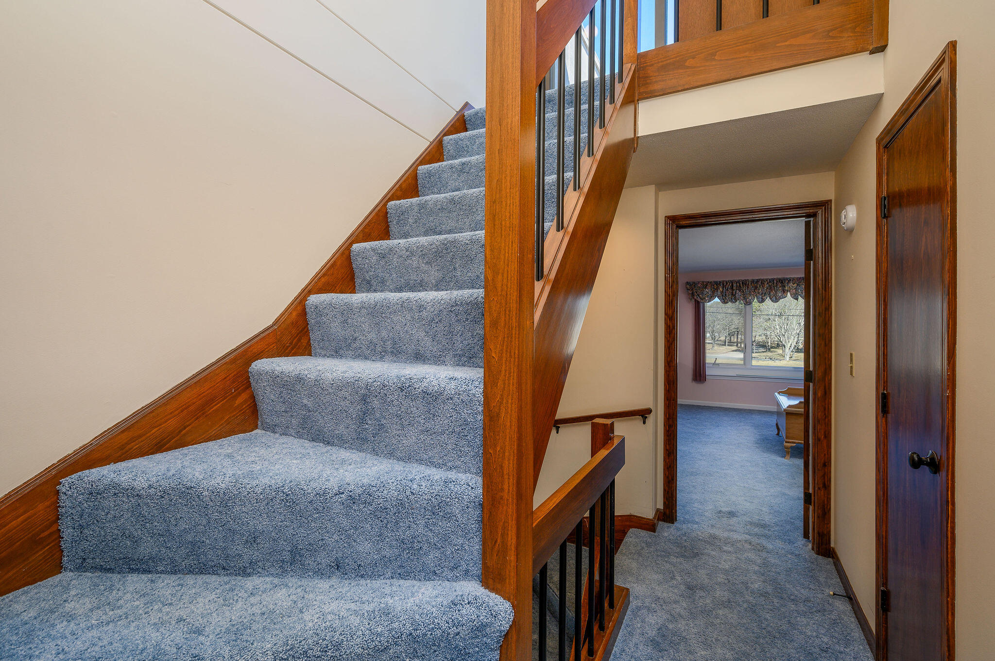 500 Ocean Street, Unit 153 Hyannis, MA 02601 - Photo 29 of 46 a view of staircase with wooden floor and a rug