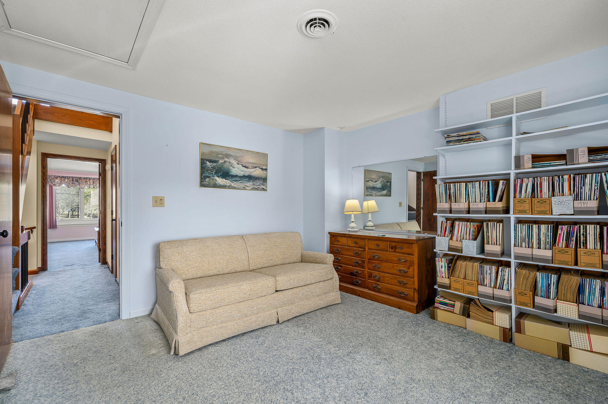 500 Ocean Street, Unit 153 Hyannis, MA 02601 - Photo 32 of 46 a living room with furniture and a book shelf