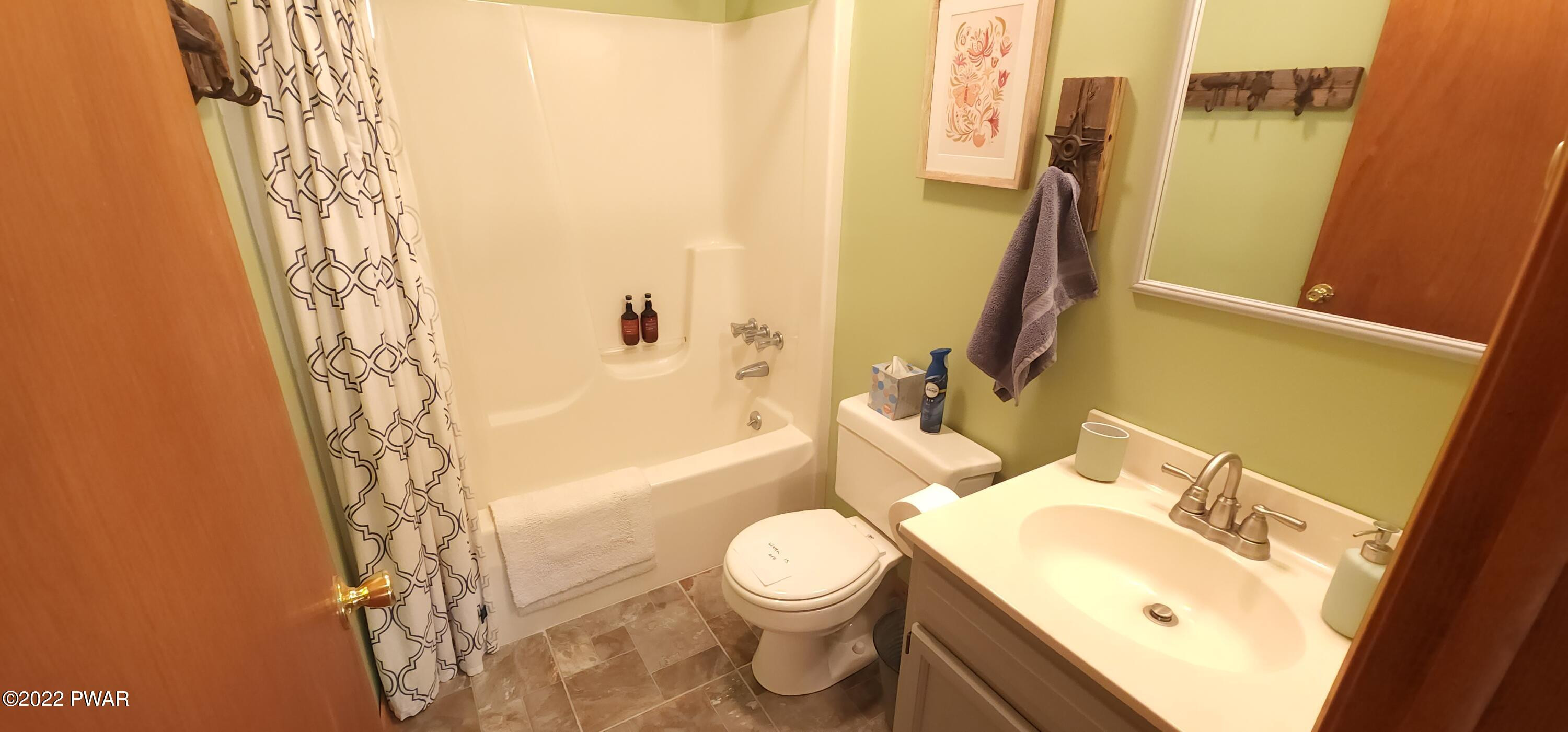40 Boulder Road Lake Ariel, PA 18436 - Photo 41 of 52 a bathroom with a sink a toilet and shower