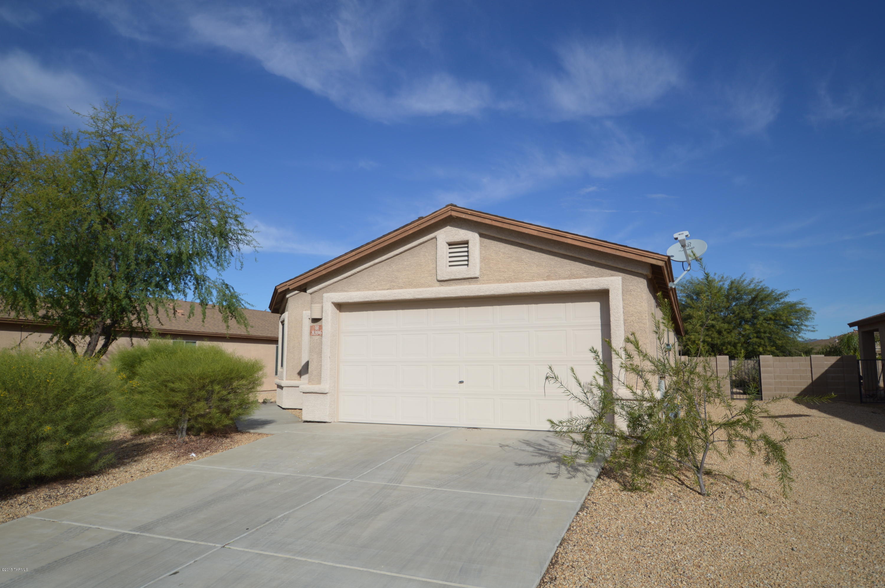 8396 West Benidorm Loop Tucson, AZ 85757 - Photo 1 of 13 a view of garage and yard