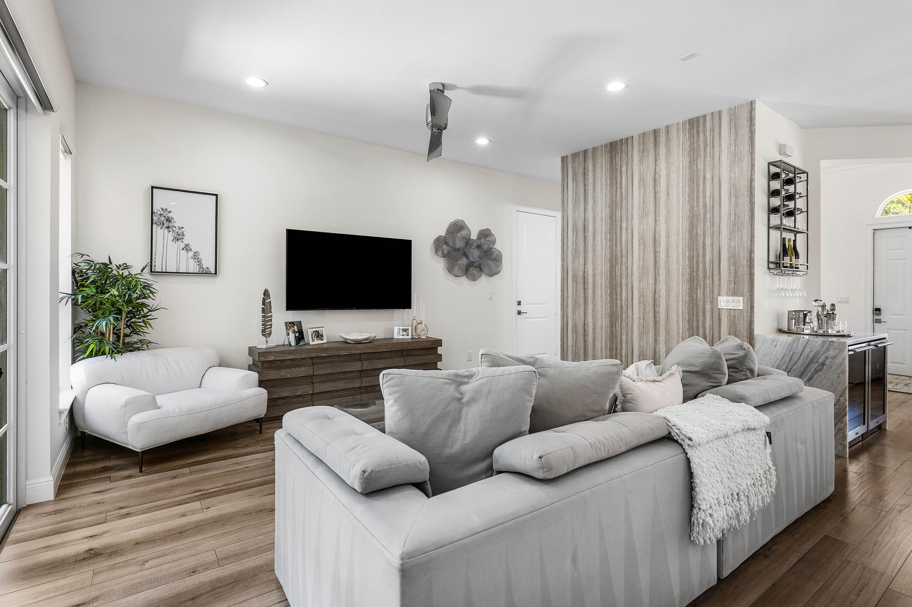 121 Via Poinciana Lane Boca Raton, FL 33487 - Photo 18 of 59 a living room with furniture and a flat screen tv